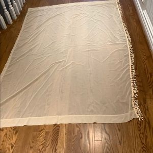 Pair of elegant sheer drapery panels, light gold with tassel trim